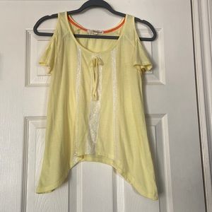 yellow top with sleeve cutouts and lace design